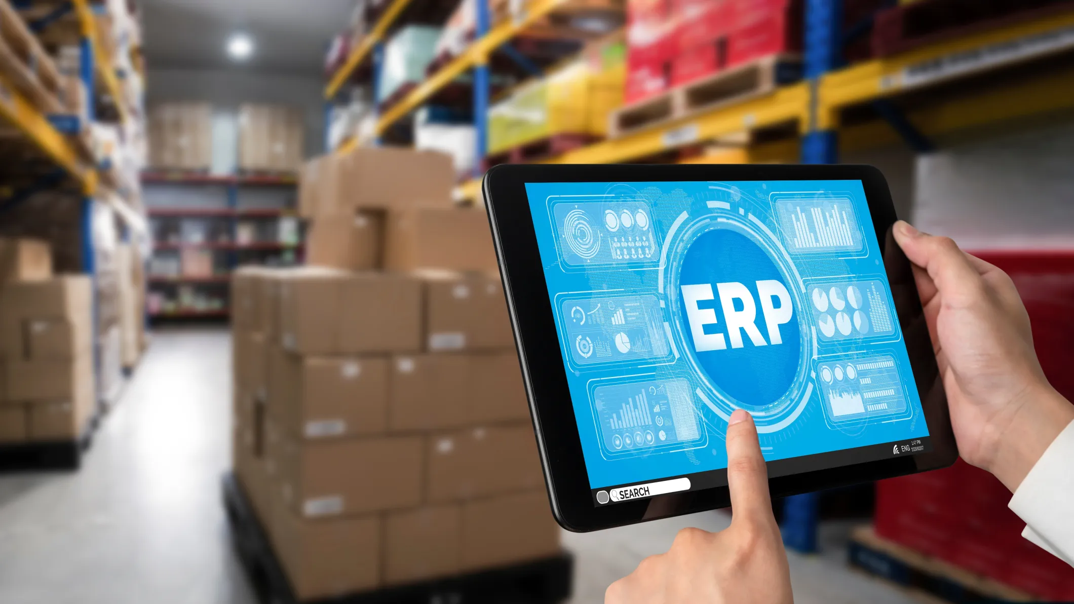 A shop floor manager uses an erp system