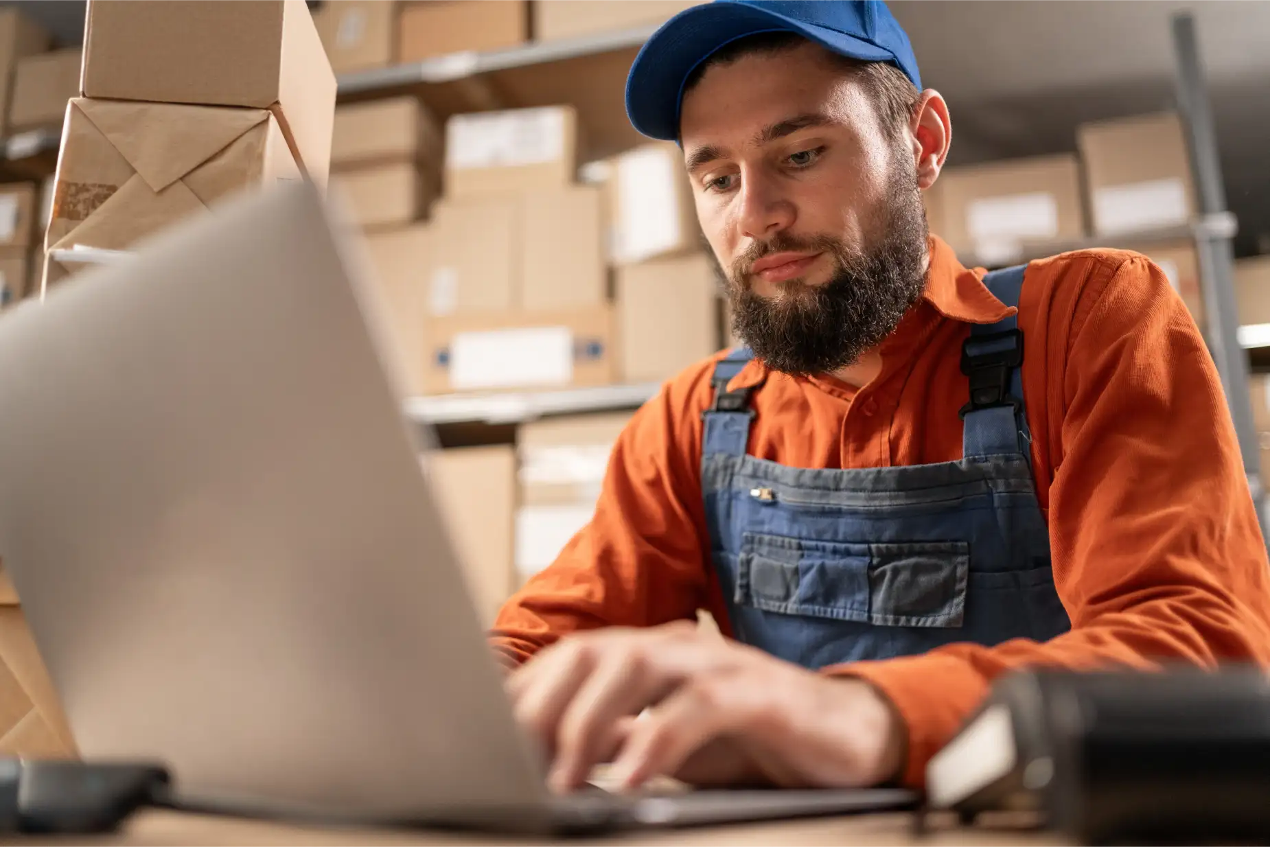 A manager using software to monitor financial performance in a retail environment