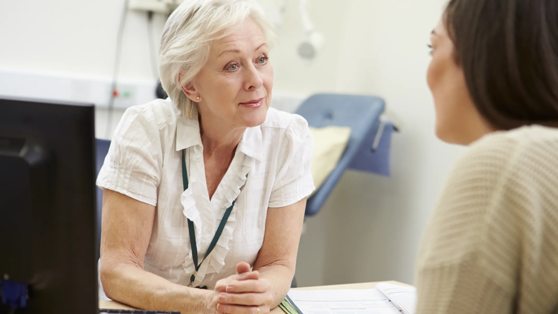 A female GP meeting with a patient