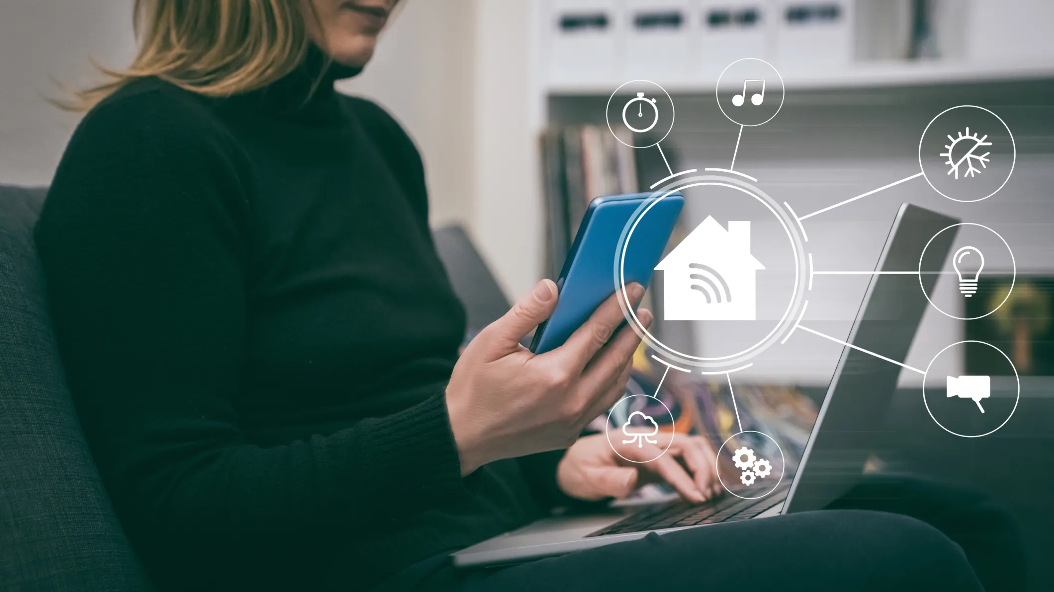 Woman uses a smartphone and laptop to manage work