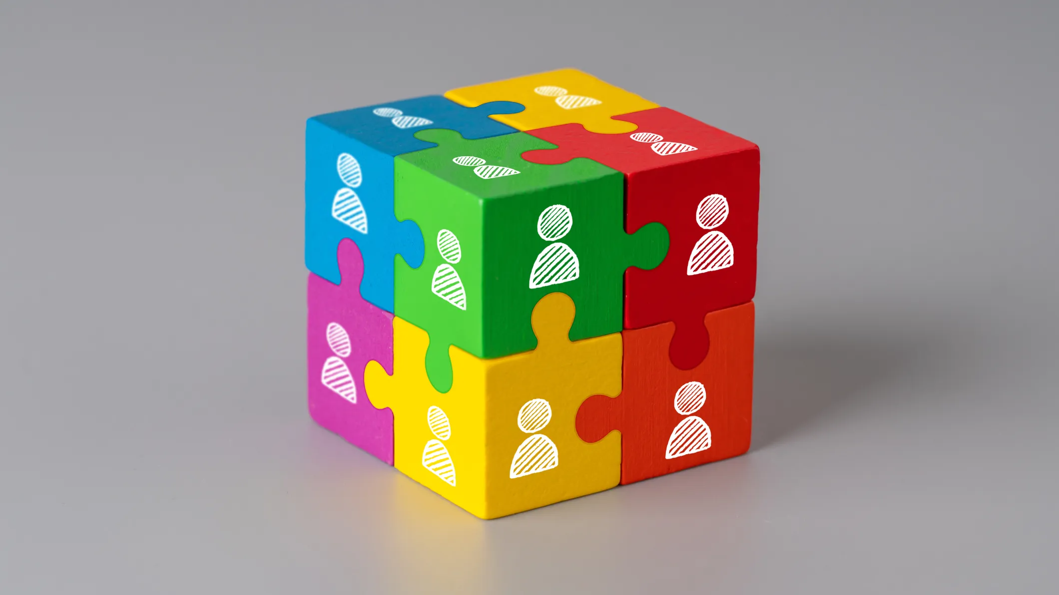 Business & HR icons on colorful jigsaw puzzle cube