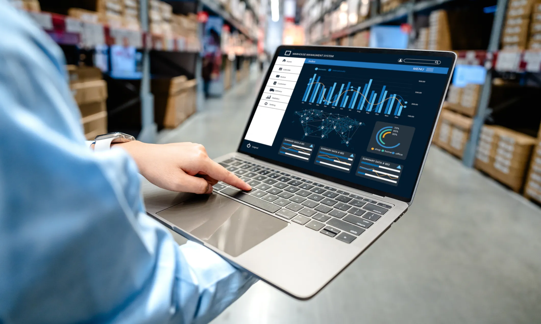 Warehouse manager monitoring operation with retail ERP software