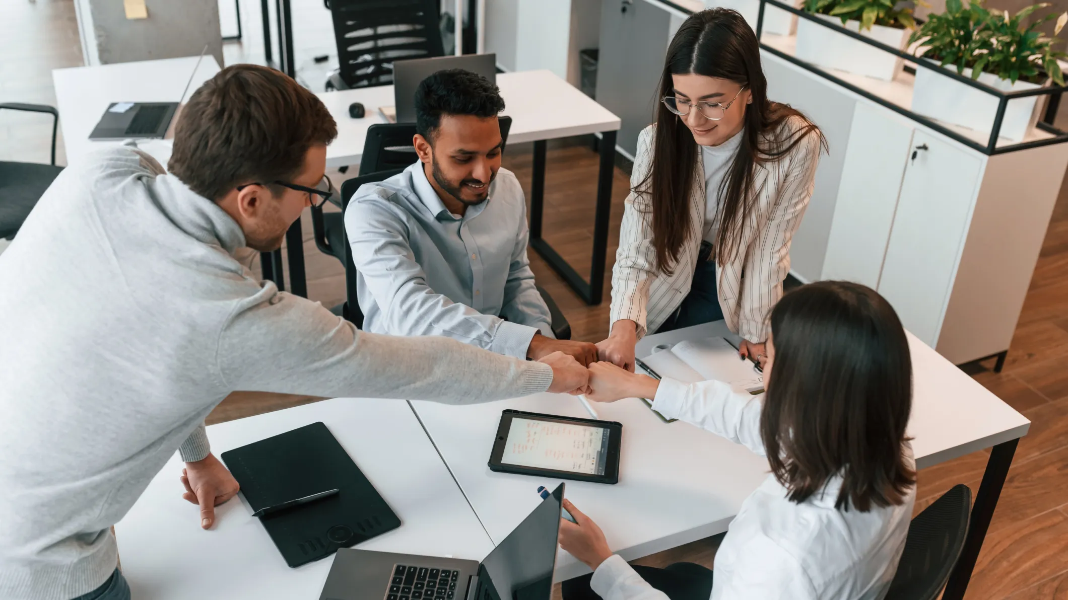 Four colleagues working together