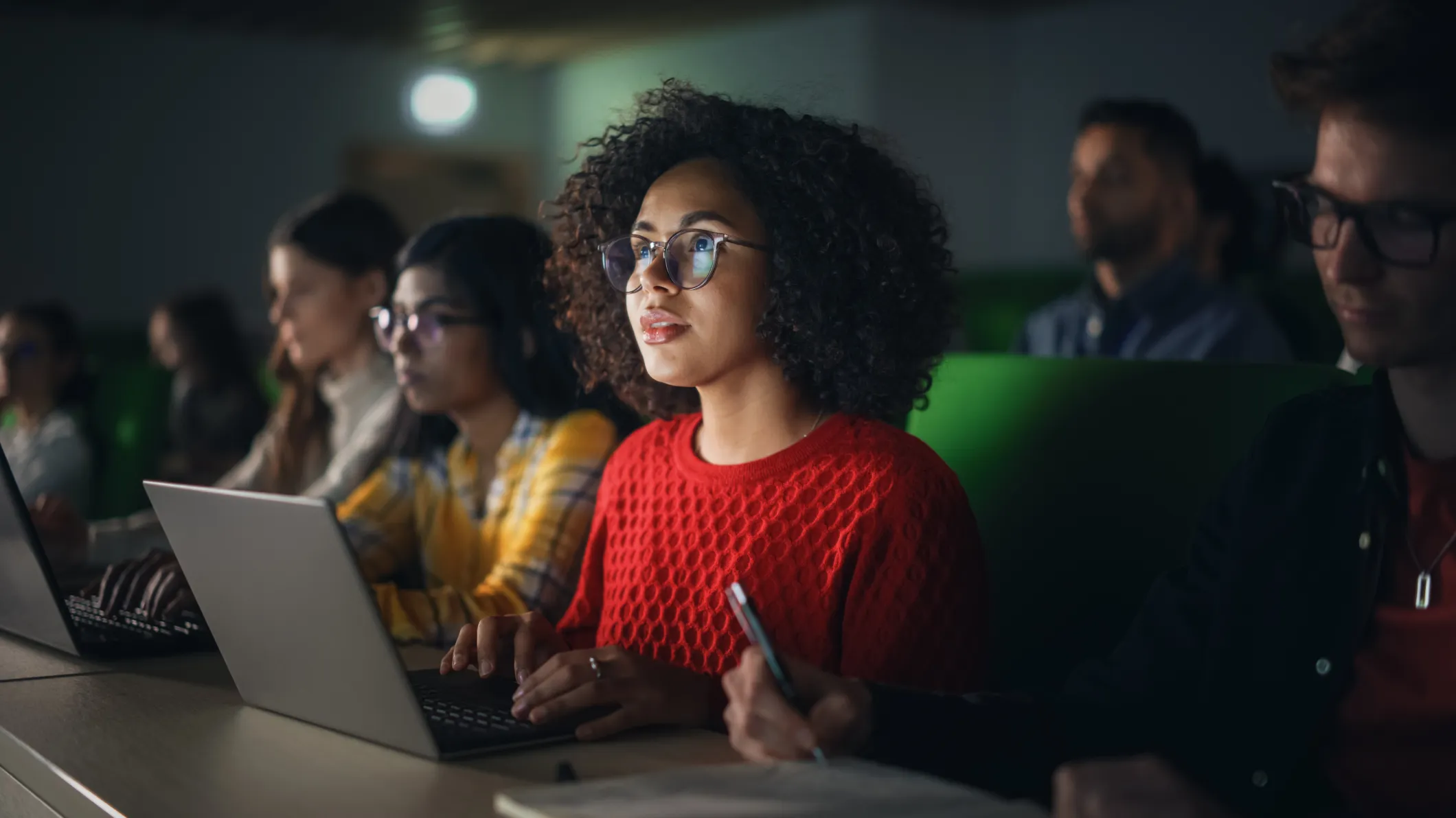 Female student watching a fascinating lecture
