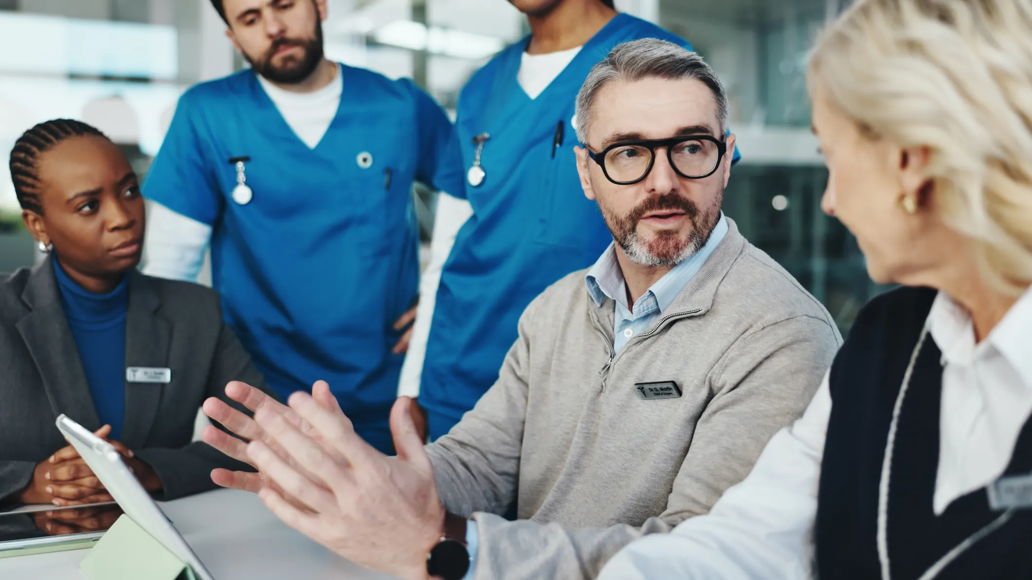 A group of nurses meet in an office