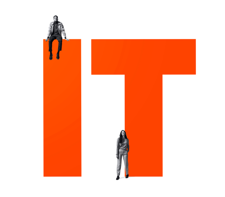 IT in large lettering with one person appearing to be sat on the letter 'I', and the other standing in front of the letter 'T'
