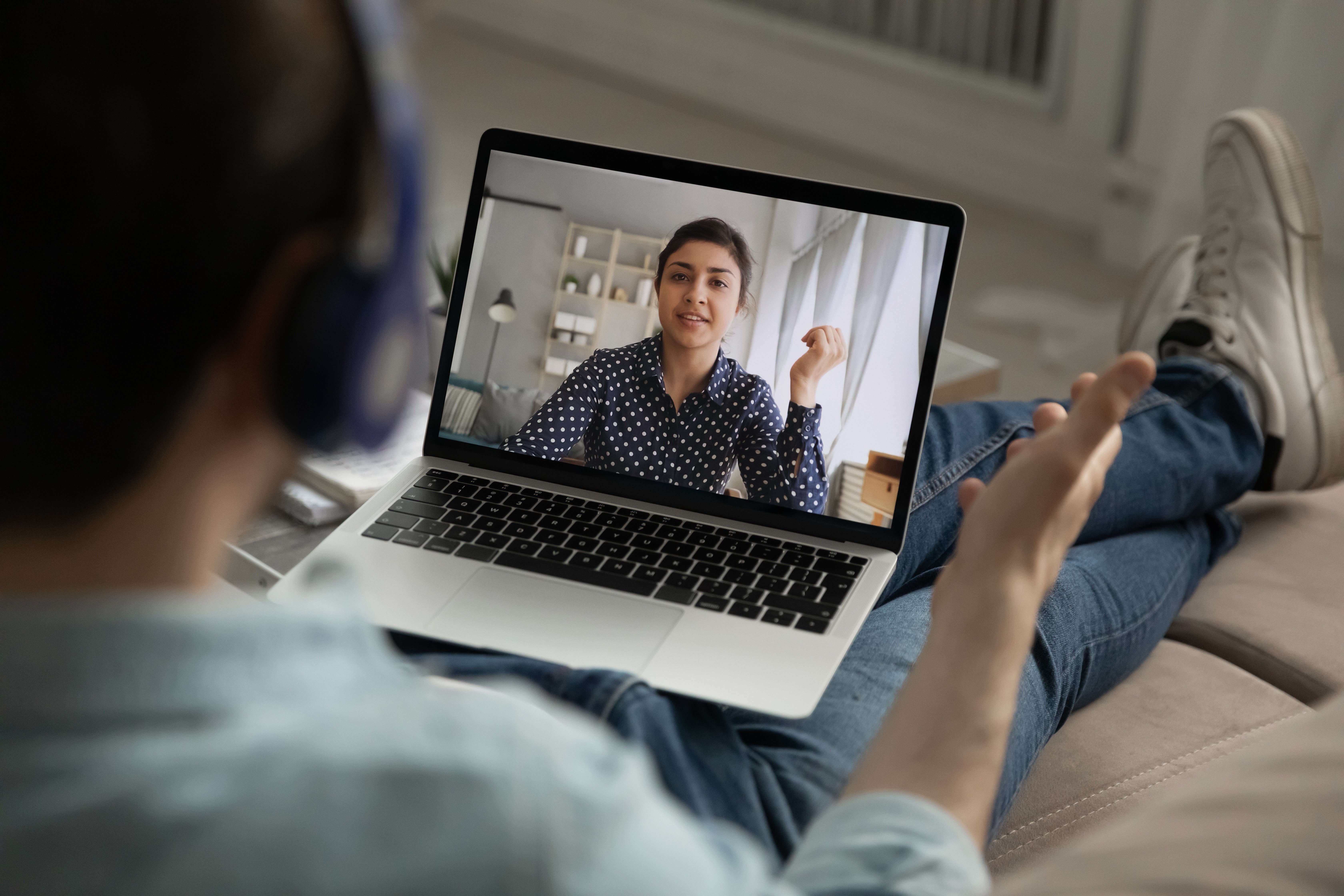 Back facing man with laptop