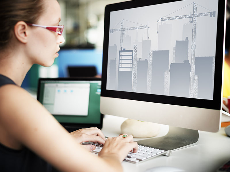 Woman on desktop using Microsoft to prepare for her digital journey