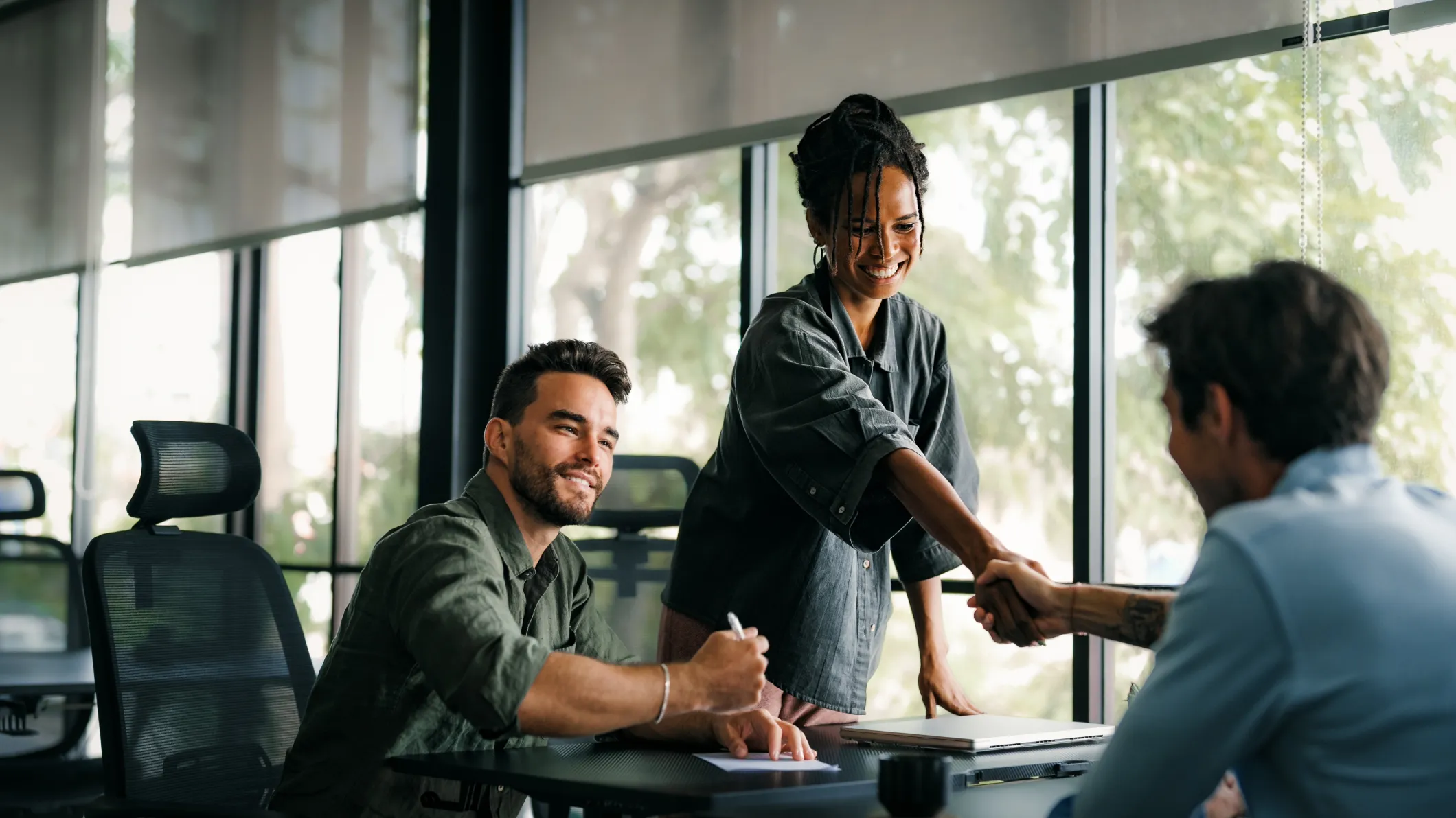 Handshake of young business woman