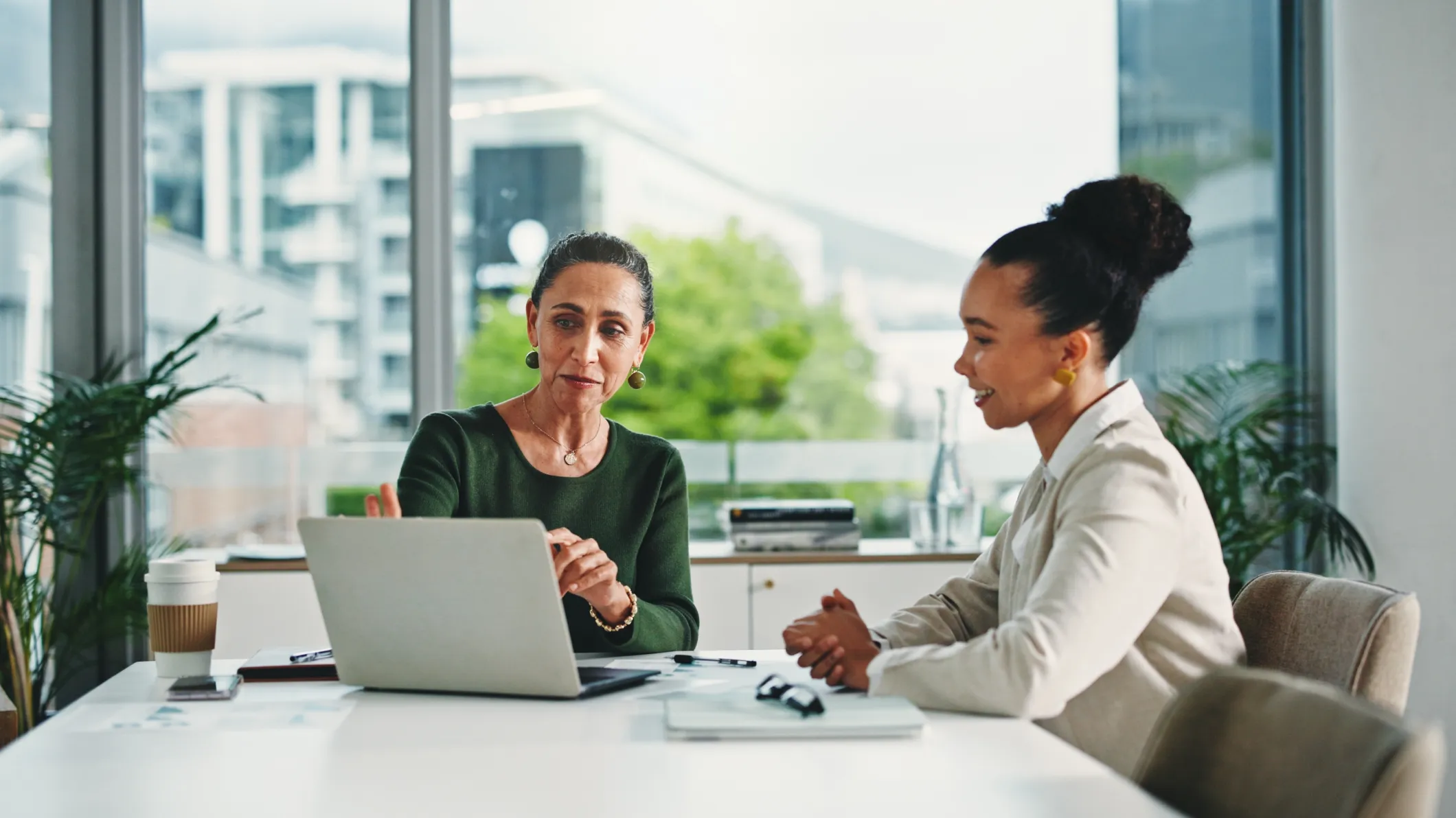 A manager and employee discuss performance and provide feedback